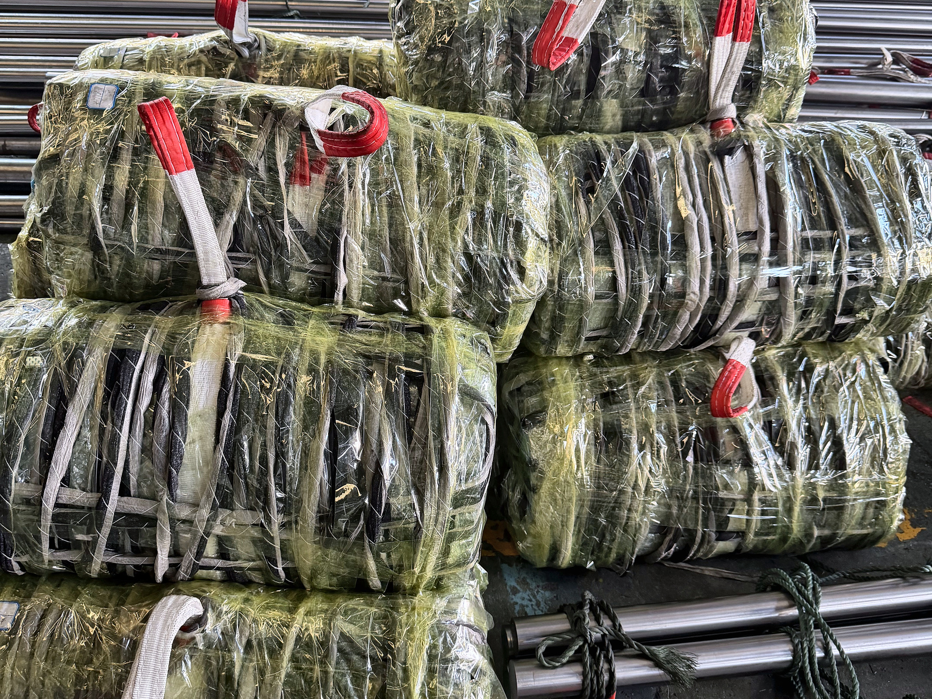 Bundles wrapped in protective film and tied with cotton rope